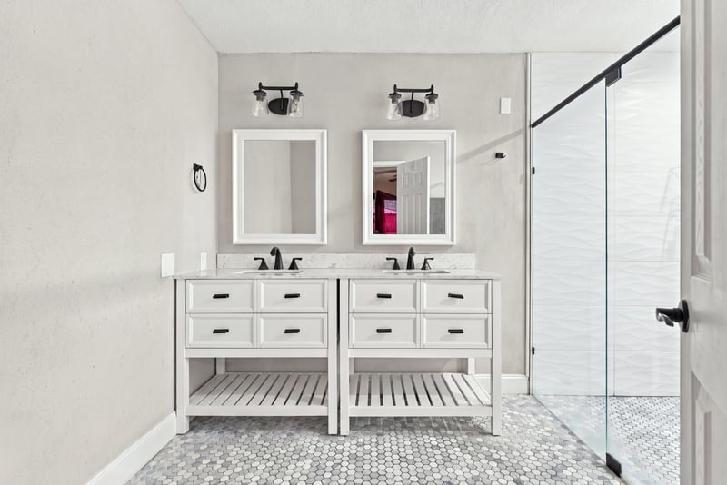 Primary bathroom with double vanity and mirrors at 357 Dillon Dr, Orange Park, FL