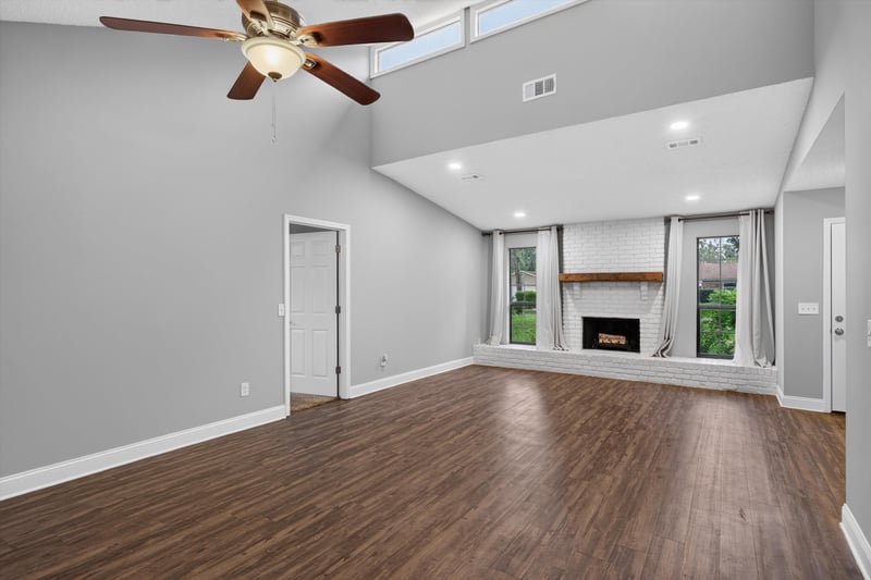 Living room with fireplace and wood floor at 12344 Cormorant Ct, Jacksonville, FL