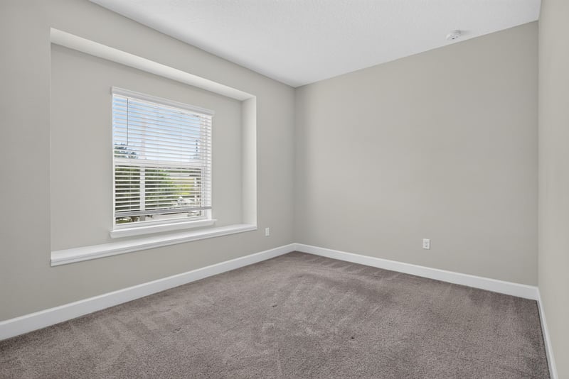 Bedroom with window and carpet at 7446 Loggerhead Ct, Jacksonville, FL 32256