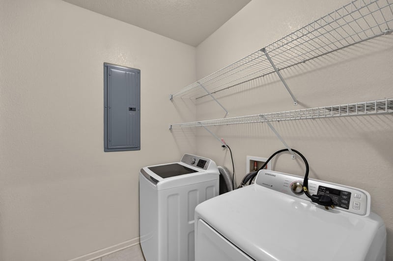 Laundry area with washer, dryer and shelving at 3750 Silver Bluff Blvd, Orange Park, FL