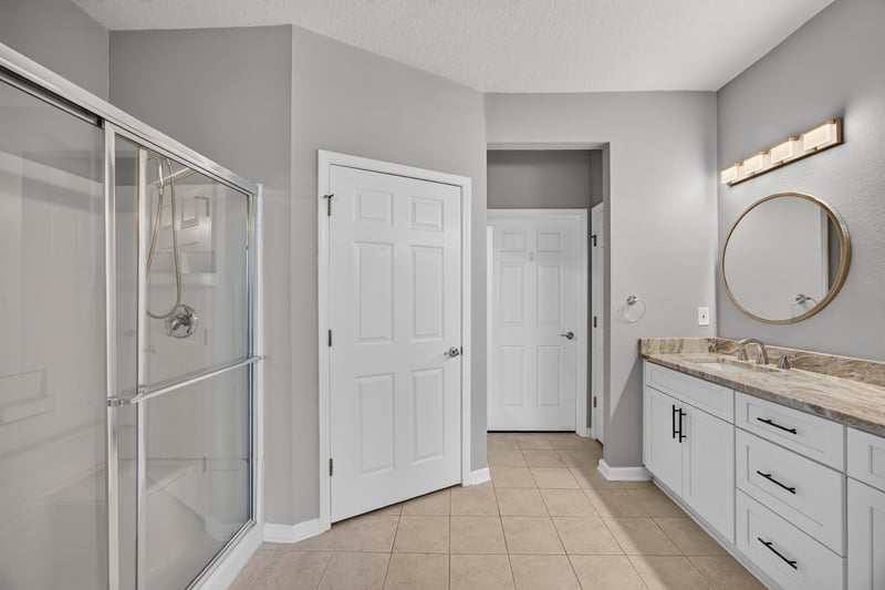 Bathroom with glass shower and closet door at 11251 Campfield Dr unit 4209, Jacksonville, FL 32256