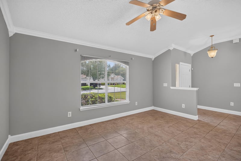 Living room with tile floor and window at 9256 Dale View Ln W, Jacksonville, FL 32225