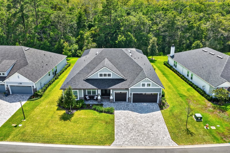 Aerial front view showing driveway and landscaping at 785 Back Creek Dr, St. Augustine, FL 32092