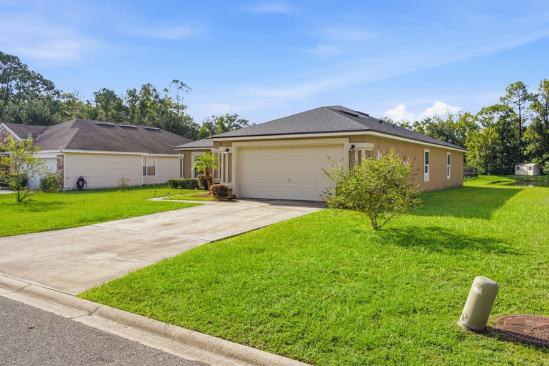 Front exterior street view with driveway at 7392 Timber Falls Ct