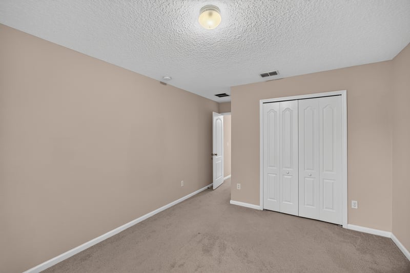 Bedroom with double closet doors at 3762 Hartsfield Forest Cir, Jacksonville, FL 32277