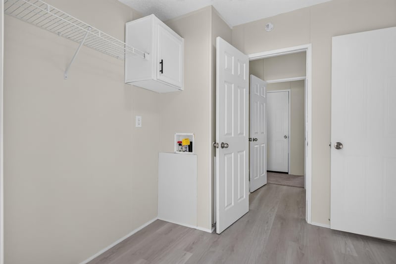 Laundry closet near hallway at 7603 Coach Park Dr, Jacksonville, FL 32244