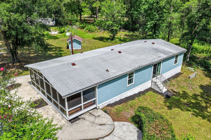 Aerial back view of home with screened porch at 4890 McAllister Rd, Middleburg, FL 32068