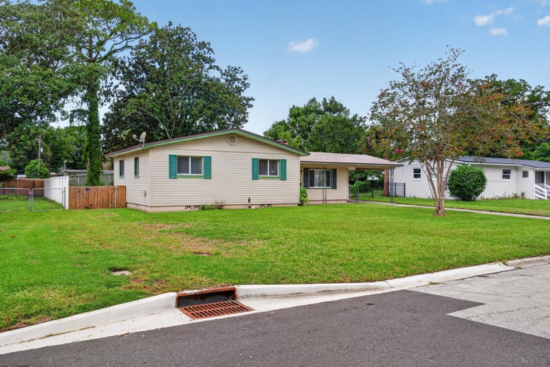 Front exterior across the lawn at 2618 Arlex Dr E, Jacksonville, FL