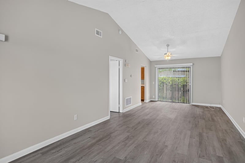 Living room with vaulted ceiling and doorway to hall at 2717 Trollie Ln, Jacksonville, FL