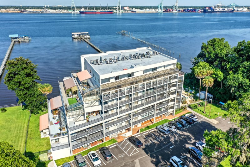 Aerial view of building with parking and docks in Jacksonville