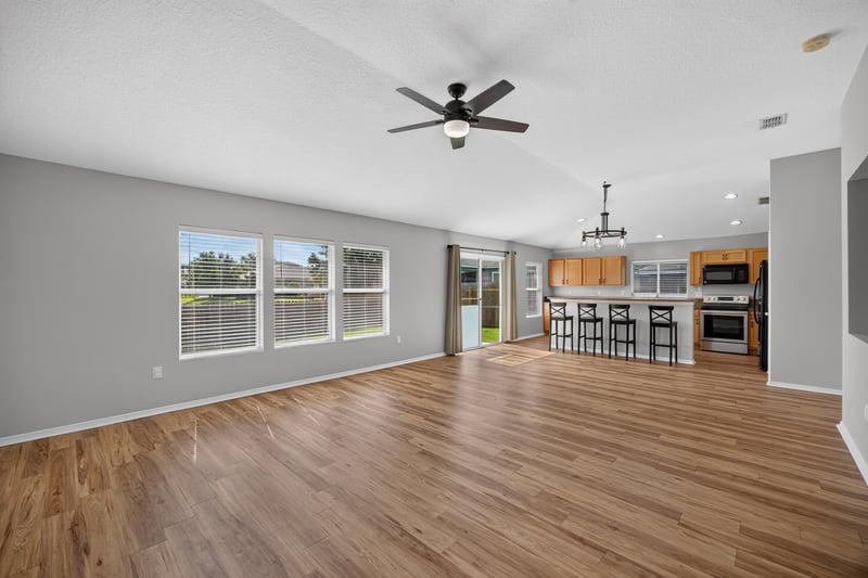 Great room with vaulted ceiling and fan at 7545 Lirope St, Jacksonville, FL 32244