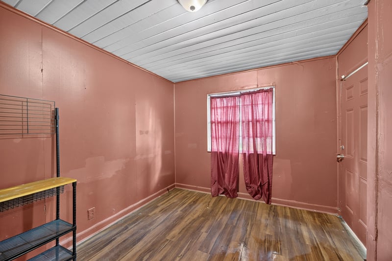 Empty room with pink curtain and laundry hookup at 2132 Allandale Cir W, Jacksonville, FL