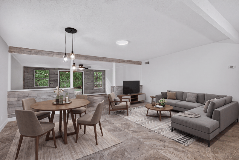 Open living and dining area with staged furniture at 3113 Kline Rd, Jacksonville, FL 32246