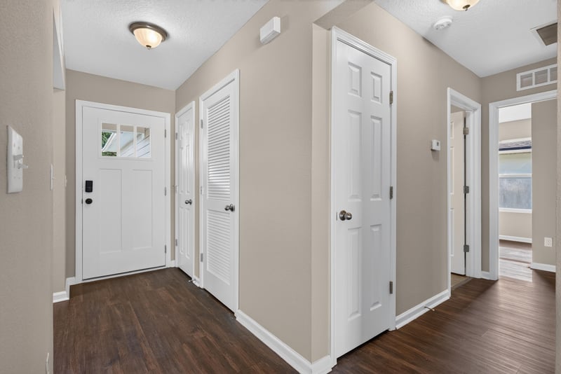 Entry hallway with multiple interior doors at 7253 Townsend Village Ct, Jacksonville, FL