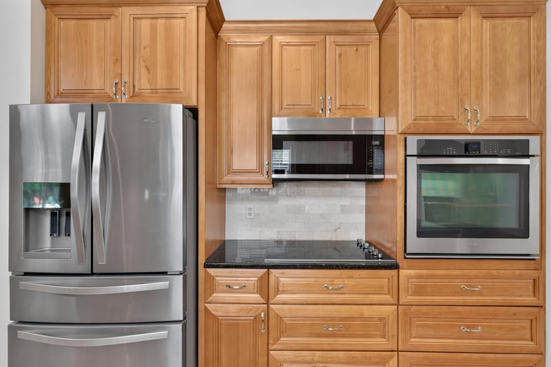 Kitchen stainless appliances and microwave at 12810 Swamp Owl Ln