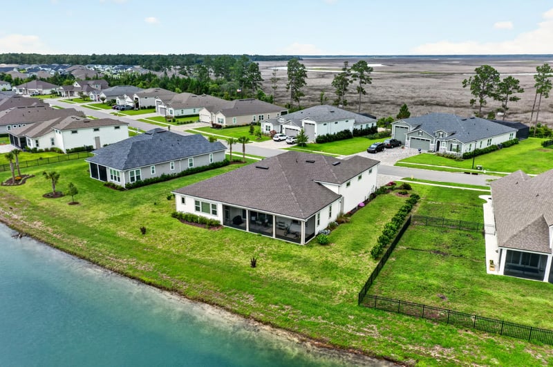 Drone view of the home and pond in Fernandina Beach, FL