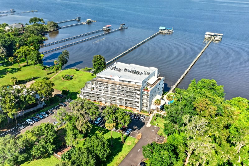 Aerial view of condo building and docks in Jacksonville