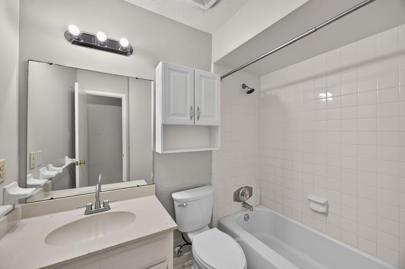 Bathroom with vanity mirror and tiled tub-shower at 12351 Condor Dr