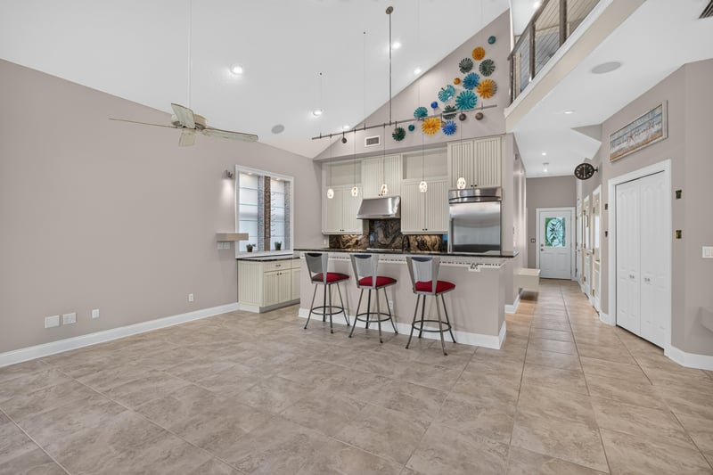 Kitchen with island and bar seating at 117 Island Cottage Way, St. Augustine, FL 32080