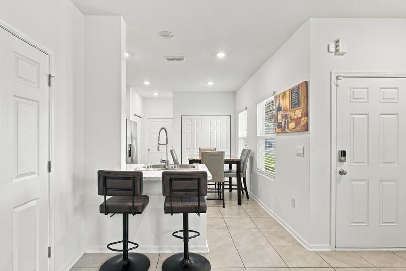 Dining area with kitchen island, photographed by Megapixeler on Haymon Ave, Jacksonville