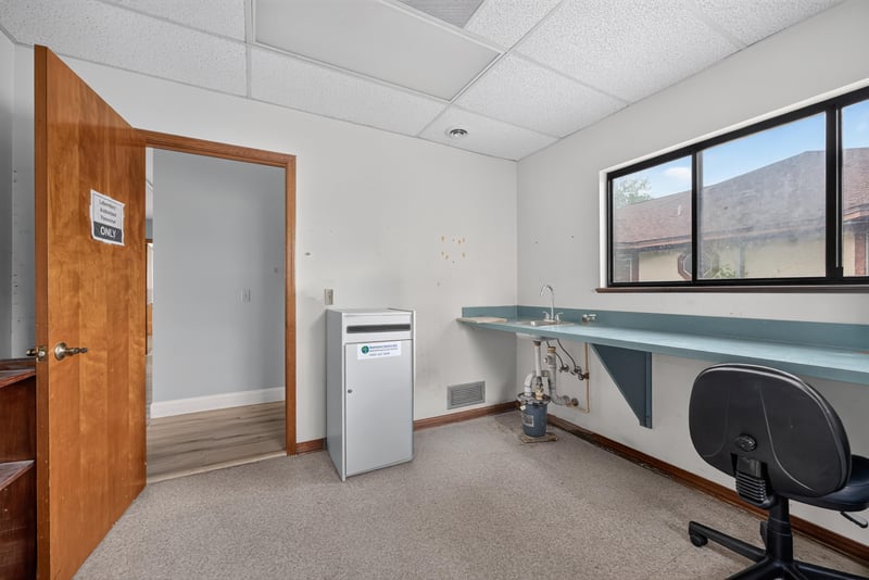 Room with built-in counter, window and rolling chair at 1543 Kingsley Ave #19, Orange Park, FL 32073