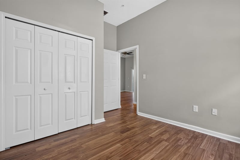 Bedroom with double closet doors at 8196 Cabin Lake Cir, Jacksonville, FL 32256