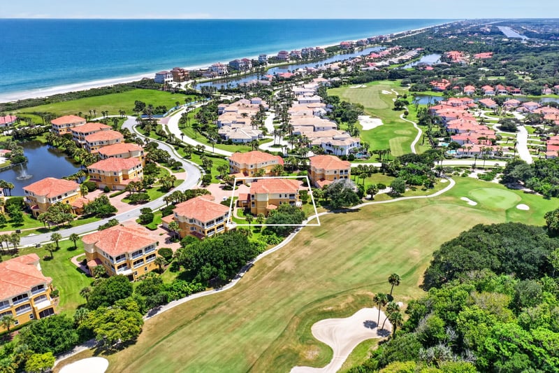 Aerial of golf course community with the ocean beyond in Palm Coast, FL