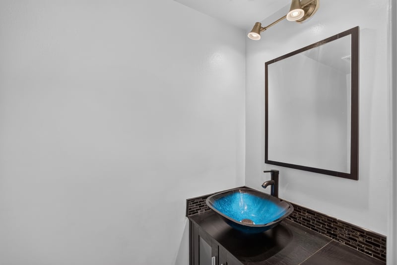 Bathroom mirror and blue vessel sink at 3428 Glenn Hollow Ct, Jacksonville, FL 32226