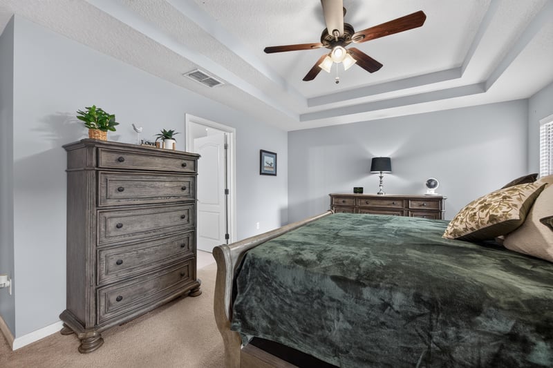 Primary bedroom dresser and natural light at 3112 Silverado Cir, Green Cove Springs, FL 32043