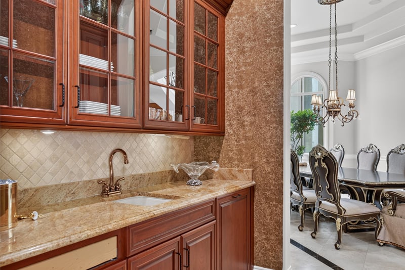 Butler's pantry with glass-front cabinets at 344 Broward Rd, Jacksonville, FL