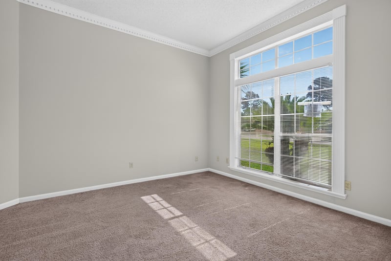 Empty room with large window and carpet at 400 Ashcroft Landing Dr, Jacksonville, FL 32225