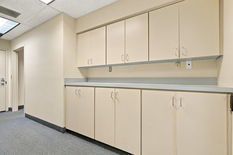 Break room with built-in cabinets and counter at 101 Scholars Wy