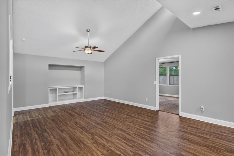 Living room with wood floor and vaulted ceiling at 12344 Cormorant Ct, Jacksonville, FL