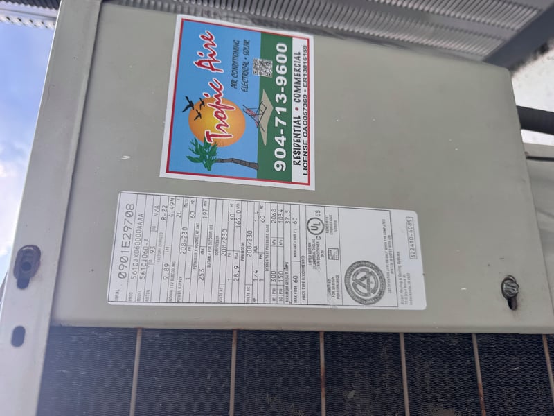 Condenser nameplate with hazardous voltage label at 11700 New Kings Rd, Jacksonville, FL 32219