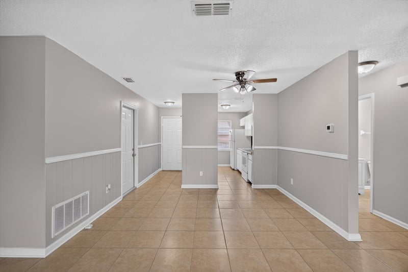 Hallway with ceiling fan and tile floor at 1040 Willow Cove Ct E, Jacksonville, FL 32233