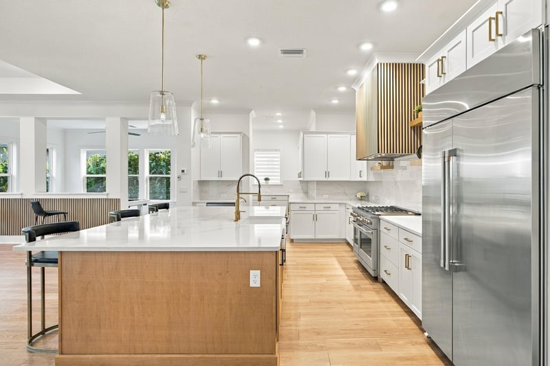Kitchen with wood cabinetry and stainless refrigerator at 907 Seagrove Dr, Ponte Vedra Beach, FL 32081