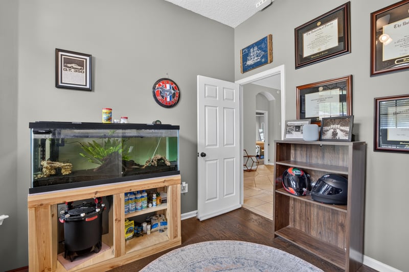 Family room with aquarium and built-in shelving at 2125 Blue Heron Cove Dr, Orange Park, FL 32003