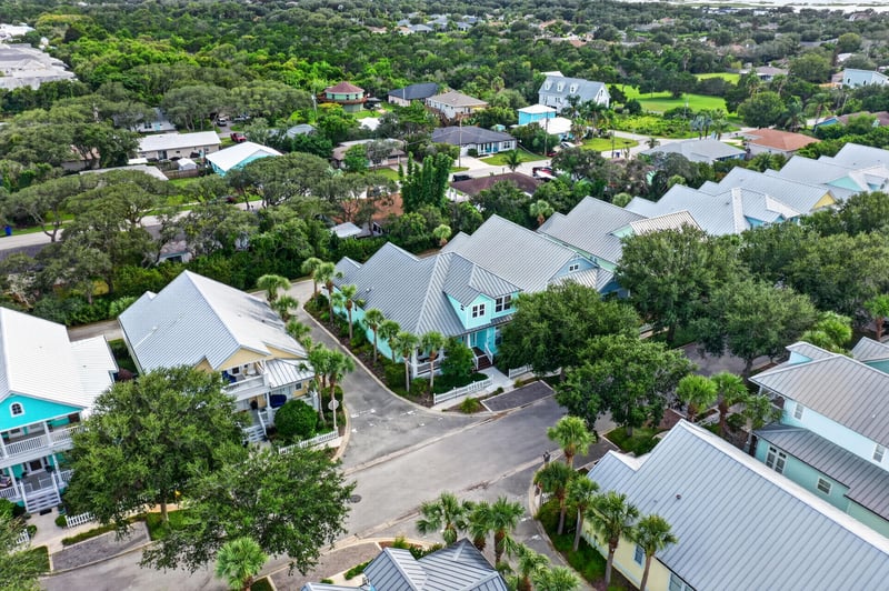 Aerial view of tree-lined streets and rooftops in St. Augustine, FL