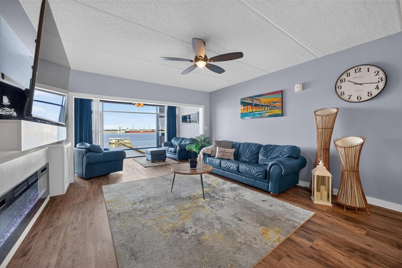 Living room with water view and decorative clock at 2280 Shepard St