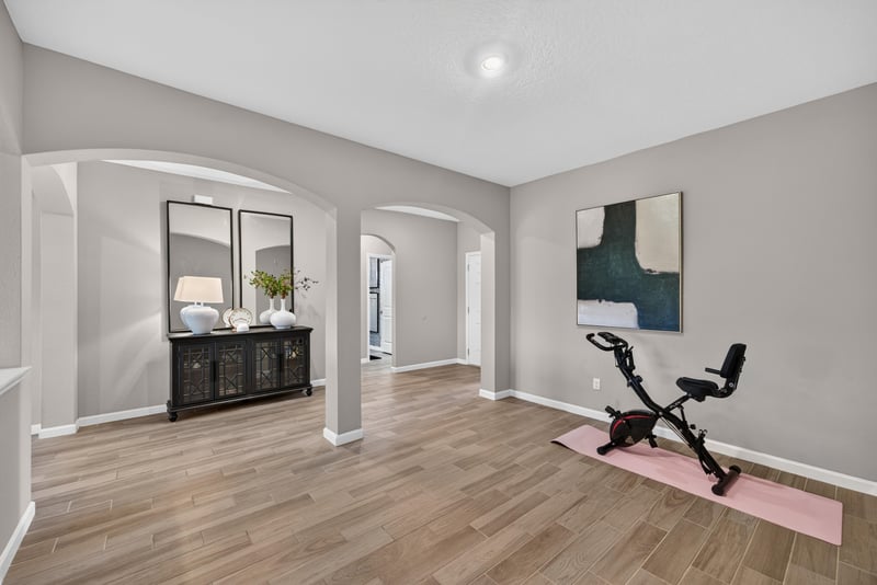 Flex room with mirror and exercise equipment at 9942 Lovage Ln, Jacksonville, FL 32219