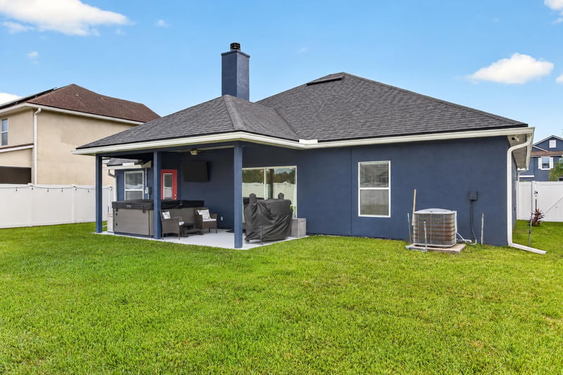 Covered patio overlooking the backyard lawn at 538 Porta Rosa Circle, St. Augustine, FL 32092