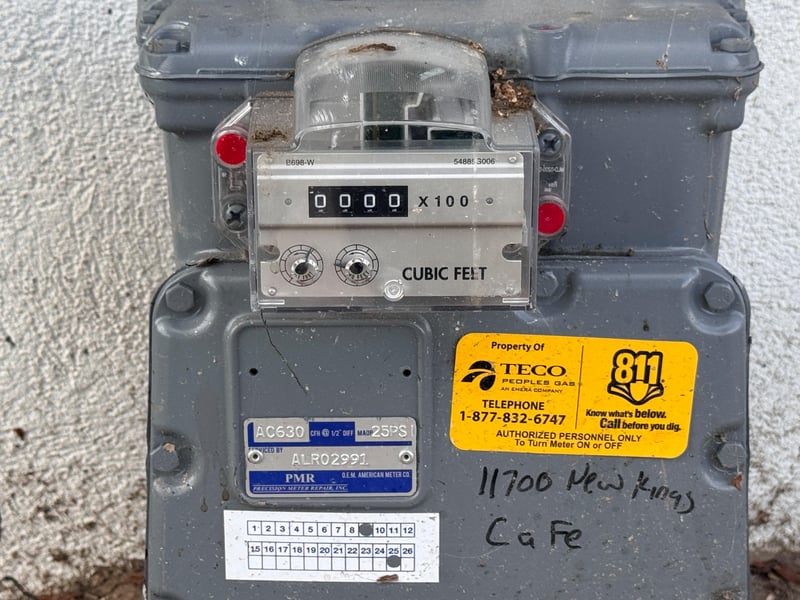 Gas meter with handwritten address tag at 11700 New Kings Rd, Jacksonville, FL 32219
