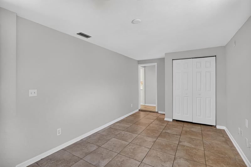 Hallway with closet door and tile flooring at 7453 Jade Dr N, Jacksonville, FL 32210