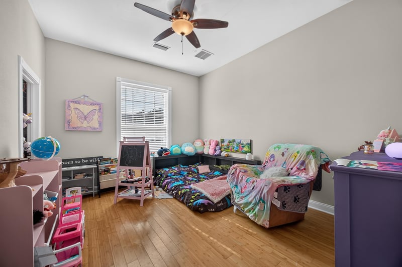 Bedroom furnished with twin beds and dresser at 1735 Hagans Ridge Ct