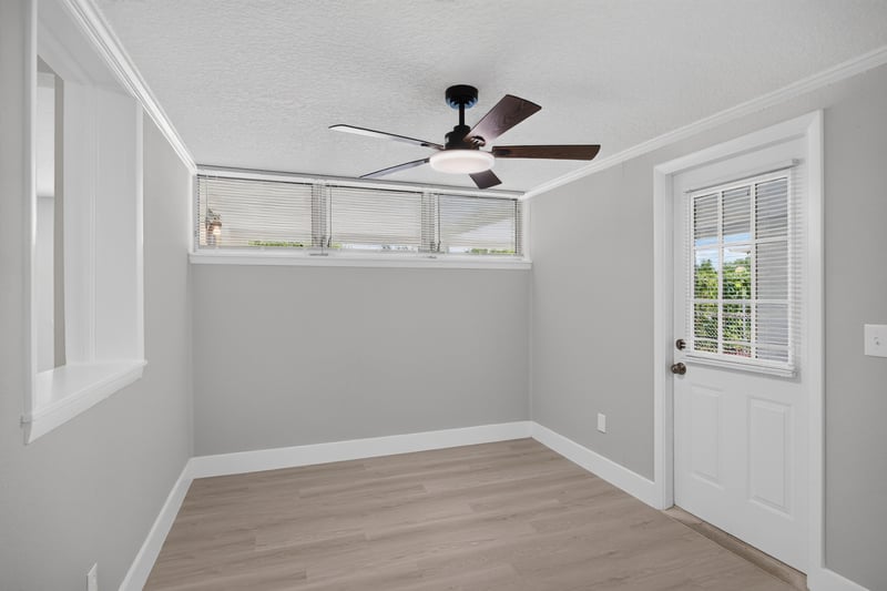 Dining space with ceiling fan and exterior door at 6238 Randia Dr, Jacksonville, FL 32210