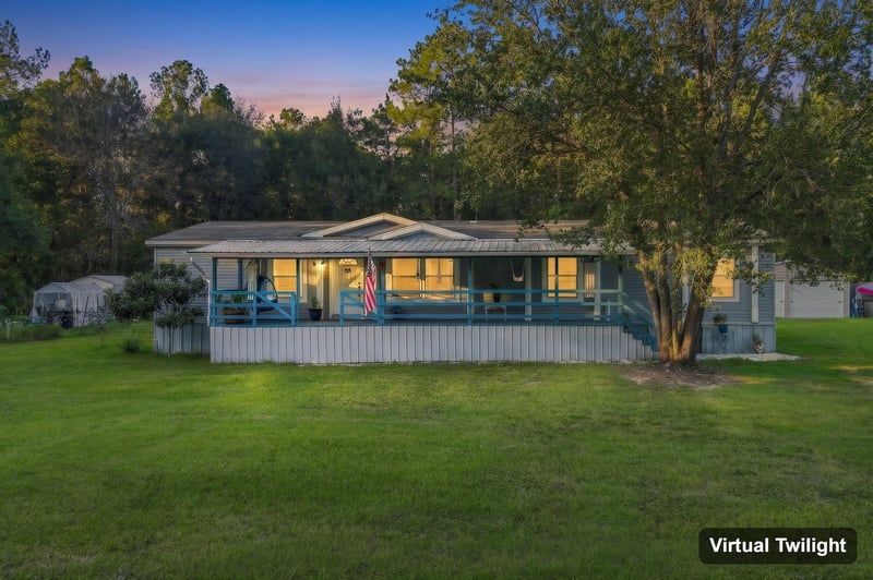 Front exterior at day-to-dusk, photographed by Megapixeler on Secret Cove Rd, Middleburg, FL