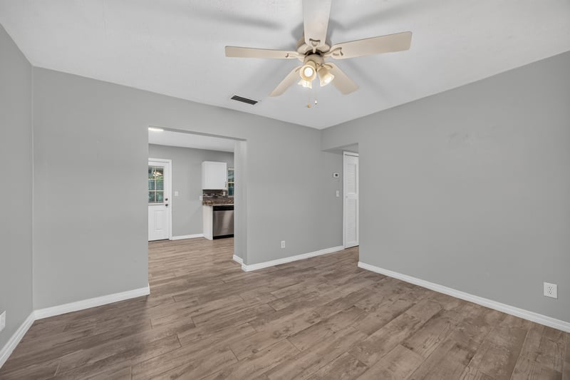 Living room, wood-look flooring open to kitchen at 2256 Inwood Cir S, Jacksonville, FL