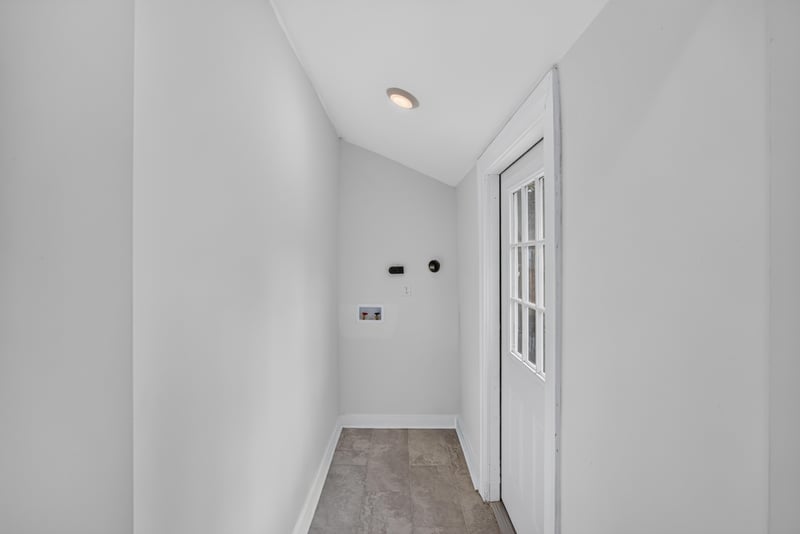 Hallway with vaulted ceiling and glass-paned door at 316 W 41st St, Jacksonville, FL 32206