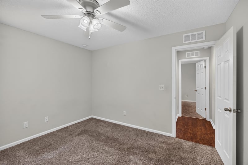 Empty bedroom with carpet and hallway view at 1002 Ingleside Ave, Jacksonville, FL 32205