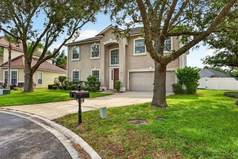 Front exterior driveway view toward the street at 2875 Pebblewood Ln, Orange Park, FL 32065